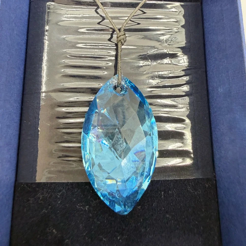 SWAROVSKI Aqua Scuro Crystal Teardrop Pendant Necklace On Black Cord-5083475